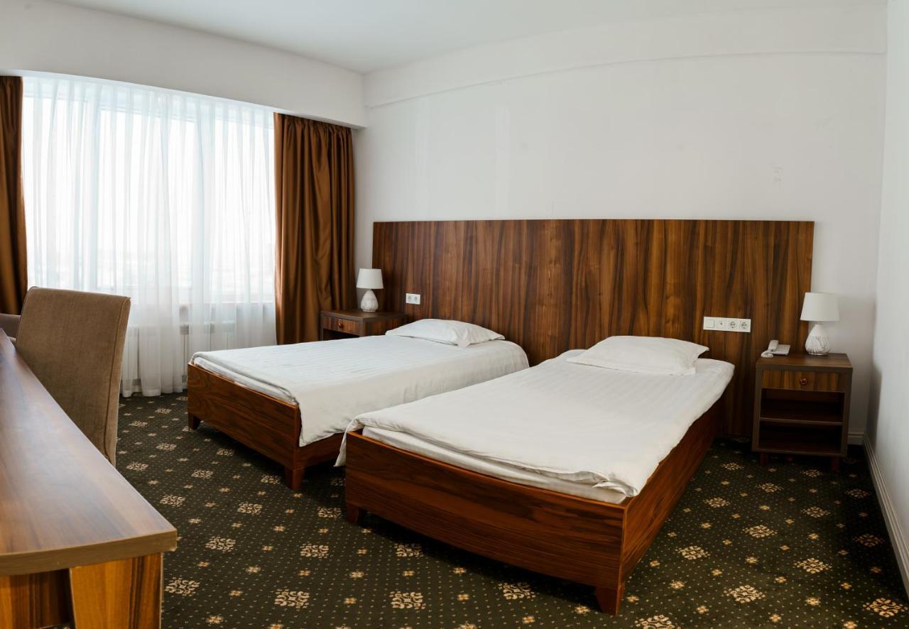 The Square Hotel Astana Bagian luar foto